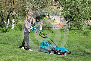 Man mowing the lawn with lawnmower