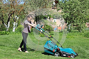 Man mowing the lawn with lawnmower