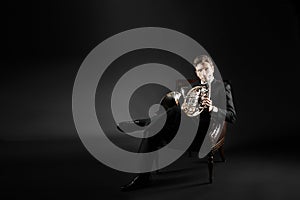 Man musician portrait with French horn