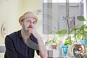 Man musing with a thought bubble over his head photo
