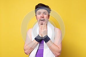 Man with mustache and towel shocked with surprise expression and excited face