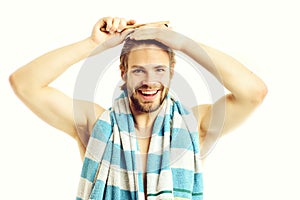 Man with naked torso, happy smiling face and beard