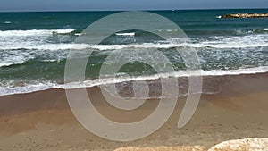 A man with a naked torso runs against sea tide