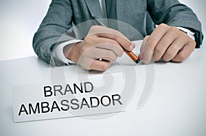 Man and name plate with the text brand ambassador photo