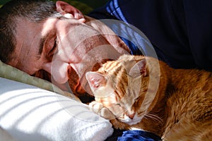 Man napping with cat