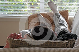 Man Napping on a Couch