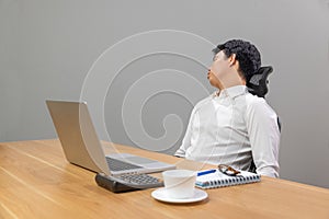 Man with narcolepsy is fall asleep on office desk.Narcolepsy is a sleep disorder that makes people very drowsy during the day photo