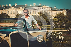 Man near classic convertible