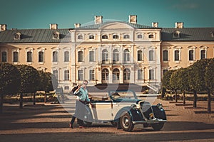 Man near classic convertible