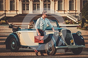 Man near classic convertible