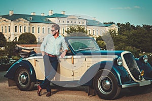 Man near classic convertible