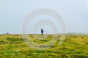 Man near the Transalpina serpentines road DN67C. This is one of the most beautiful alpine routes in Romania