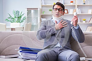 The man in neck brace cervical collar working from home teleworking