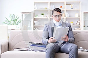 The man in neck brace cervical collar working from home teleworking