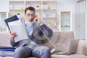 The man in neck brace cervical collar working from home teleworking