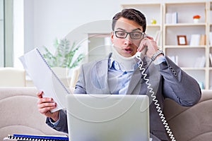 The man in neck brace cervical collar working from home teleworking