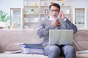 The man in neck brace cervical collar working from home teleworking