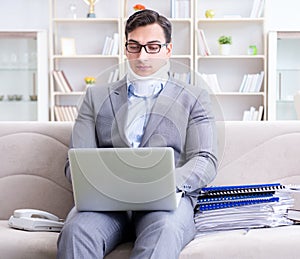 Man in neck brace cervical collar working from home teleworking