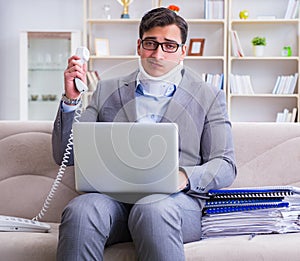 Man in neck brace cervical collar working from home teleworking