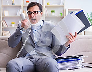 Man in neck brace cervical collar working from home teleworking