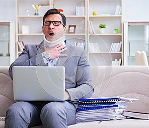 Man in neck brace cervical collar working from home teleworking