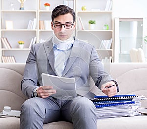 Man in neck brace cervical collar working from home teleworking