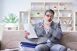 The man in neck brace cervical collar working from home teleworking