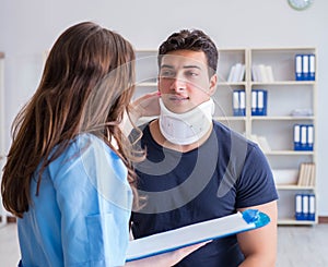 Man with neck injury visiting doctor for check-up