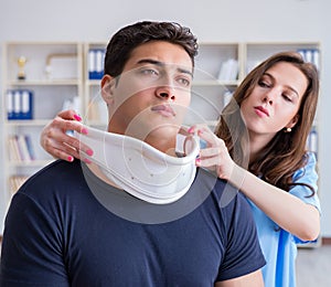 Man with neck injury visiting doctor for check-up