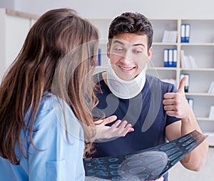 Man with neck injury visiting doctor for check-up