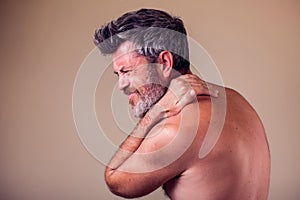 Man with neck pain. People, health care, medicine concept