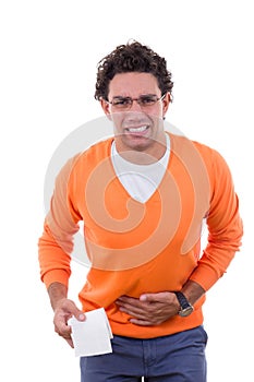 Man in need with stomach problems holding toilet paper in orange