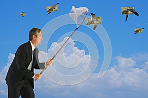 Man netting flying money financial success