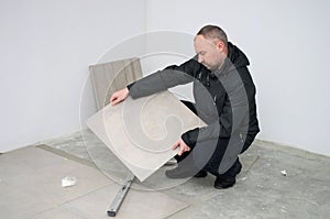 Man with new floor tiles