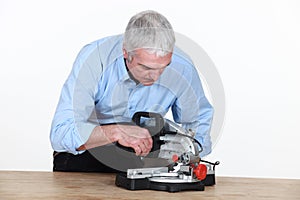 Man with new mitre saw