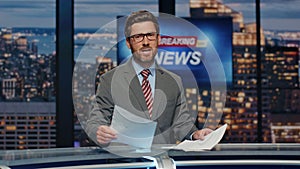 Man newsreader reporting live program at newscast multimedia channel closeup photo