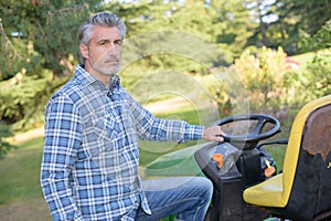 Man next to mower