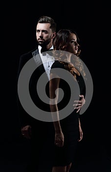 Man next to woman posing in studio