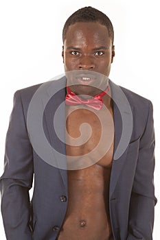 Man no shirt bowtie jacket serious