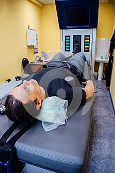 Man at non-surgical spinal decompression procedure