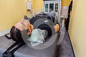 Man at non-surgical spinal decompression procedure