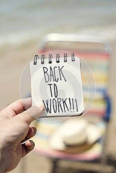 Man with a note with the text back to work