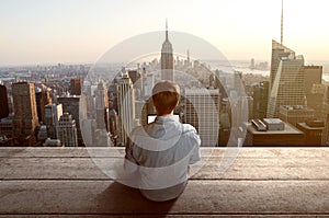 Man with notebook on rooftop