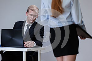 Man observing co-worker's legs