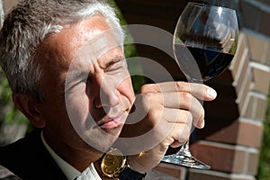 Man observing color in wine