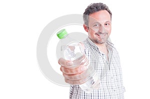 Man offering, giving a bottle of cold water