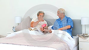 Man offering a present to his wife