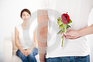 Man offering rose to his girlfriend