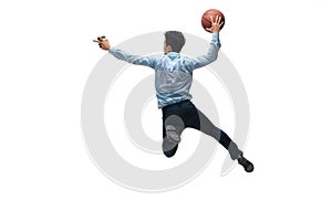 Man in office clothes playing basketball on white background. Unusual look for businessman in motion, action. Sport