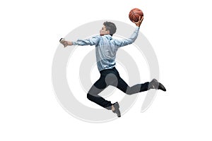 Man in office clothes playing basketball on white background. Unusual look for businessman in motion, action. Sport
